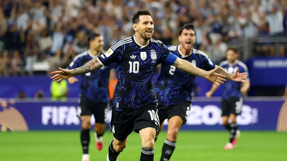 Argentina key player Messi hold his teammate to celebrate his scores during a 3-1 World Cup win against Jordan