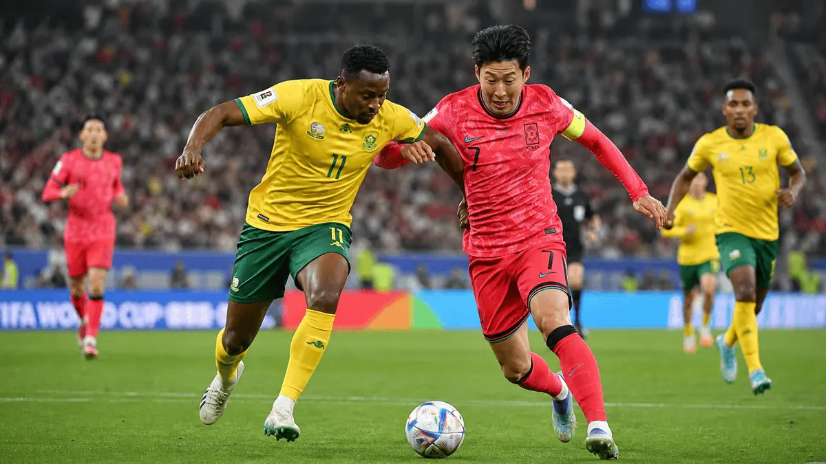 Korea Son Heung-min competed the ball with south africa player